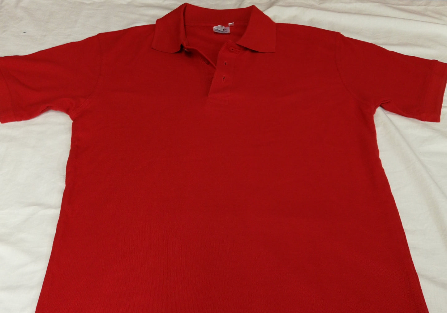 Polo tinta unita personalizzabile con toppe